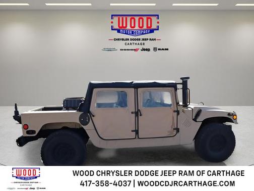 Beige 1999 AM General Hummer