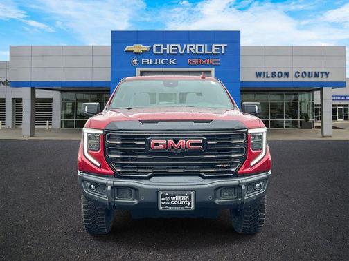 Volcanic Red Tintcoat 2026 GMC Sierra 1500 AT4X