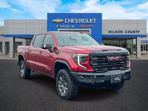 Volcanic Red Tintcoat 2026 GMC Sierra 1500 AT4X