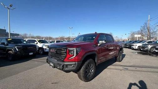 Volcanic Red Tintcoat 2026 GMC Sierra 1500 AT4X