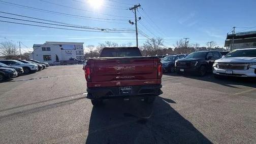 Volcanic Red Tintcoat 2026 GMC Sierra 1500 AT4X