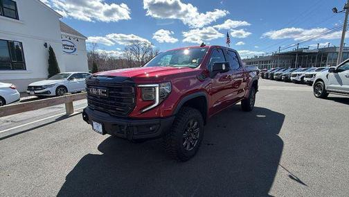 Volcanic Red Tintcoat 2026 GMC Sierra 1500 AT4X