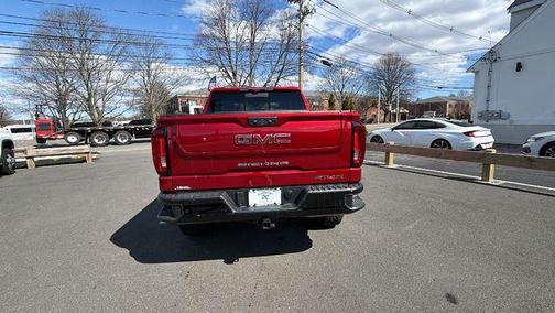 Volcanic Red Tintcoat 2026 GMC Sierra 1500 AT4X