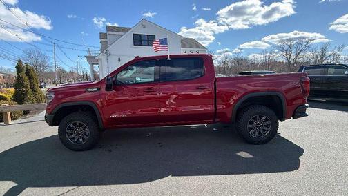 Volcanic Red Tintcoat 2026 GMC Sierra 1500 AT4X