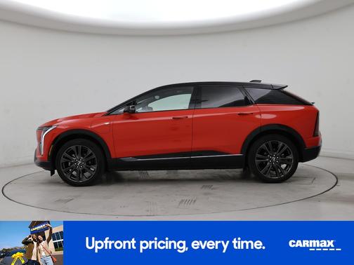 Orange 2026 Cadillac OPTIQ Premium Sport