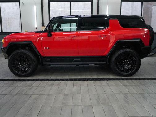 Solar Orange 2026 GMC HUMMER EV SUV 2X