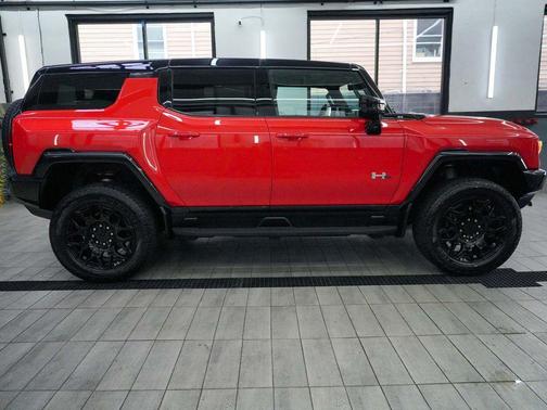 Solar Orange 2026 GMC HUMMER EV SUV 2X