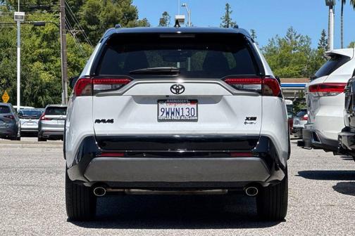 Wind Chill Pearl/Midnight Black Metallic 2025 Toyota RAV4 Hybrid SE