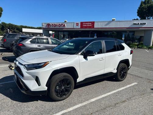 Wind Chill Pearl/Midnight Black Metallic 2025 Toyota RAV4 Hybrid SE