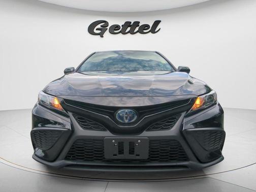 Midnight Black Metallic 2023 Toyota Camry Hybrid SE