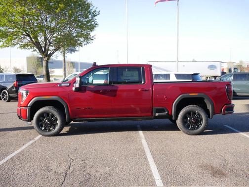 Volcanic Red Tintcoat 2026 GMC Sierra 3500 AT4