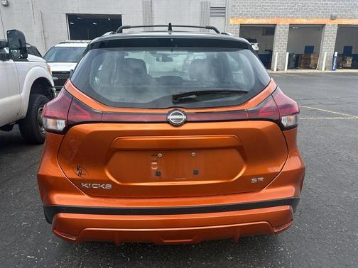 Monarch Orange / Super Black 2023 Nissan Kicks SR