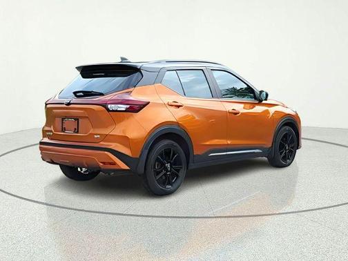 Monarch Orange / Super Black 2023 Nissan Kicks SR