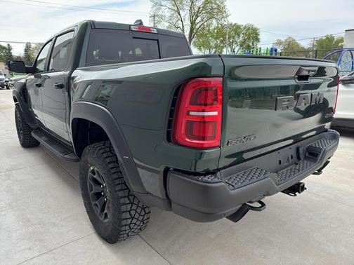 Serrano Green Metallic 2026 RAM 1500 RHO Crew Cab 4x4 5'7' Box