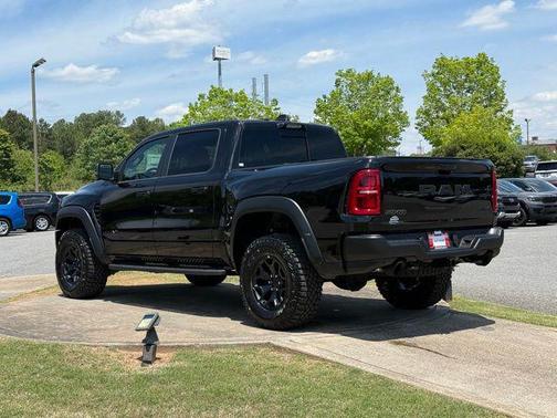 Diamond Black Crystal Pearlcoat 2026 RAM 1500 RHO Crew Cab 4x4 5'7' Box