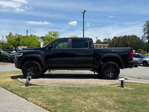 Diamond Black Crystal Pearlcoat 2026 RAM 1500 RHO Crew Cab 4x4 5'7' Box