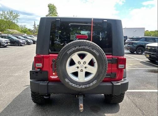Red 2010 Jeep Wrangler Sport