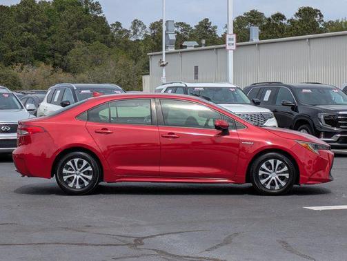 Barcelona Red Metallic 2021 Toyota Corolla Hybrid LE