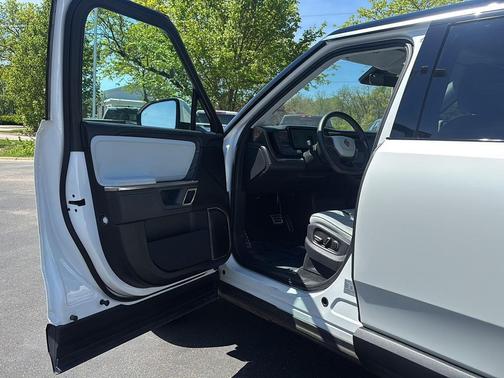 Glacier White 2024 Rivian R1S Adventure Quad Motor Large Pack