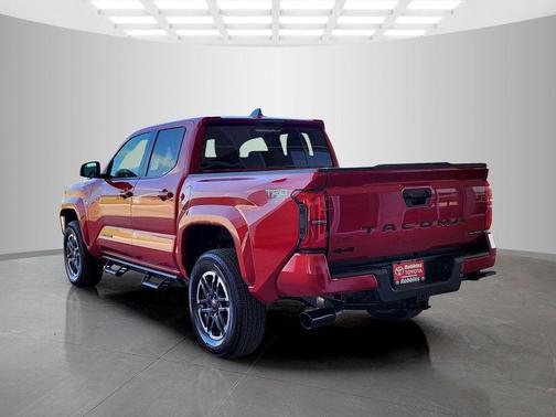 Red 2026 Toyota Tacoma Hybrid TRD Sport