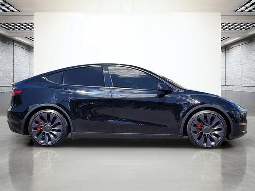 Solid Black 2025 Tesla Model Y Performance Dual Motor All-Wheel Drive