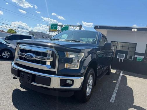 Blue 2015 Ford F-150 Lariat Truck