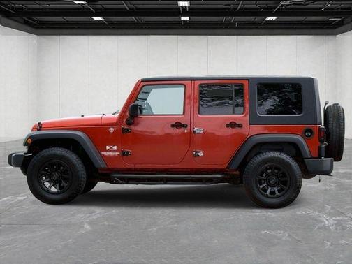Sunburst Orange Pearl 2009 Jeep Wrangler Unlimited X