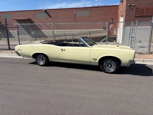 Yellow 1966 Pontiac GTO TRI-POWER