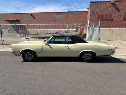 Yellow 1966 Pontiac GTO TRI-POWER
