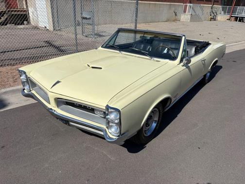 Yellow 1966 Pontiac GTO TRI-POWER