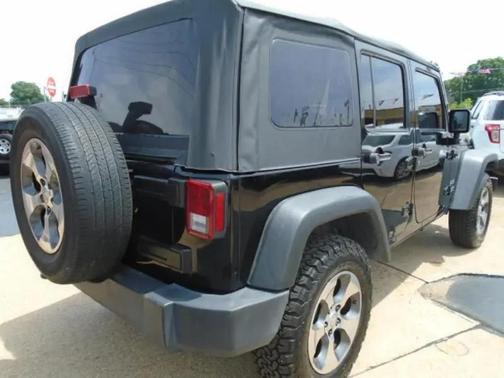 Black 2014 Jeep Wrangler Unlimited Sport