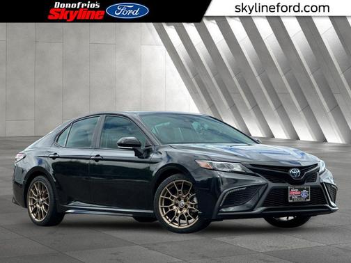 Midnight Black Metallic 2024 Toyota Camry Hybrid SE Sedan
