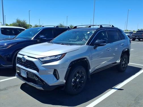 Silver Sky Metallic/Midnight Black Metallic 2024 Toyota RAV4 Hybrid SE