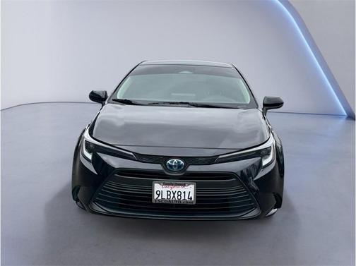 Midnight Black Metallic 2024 Toyota Corolla Hybrid LE