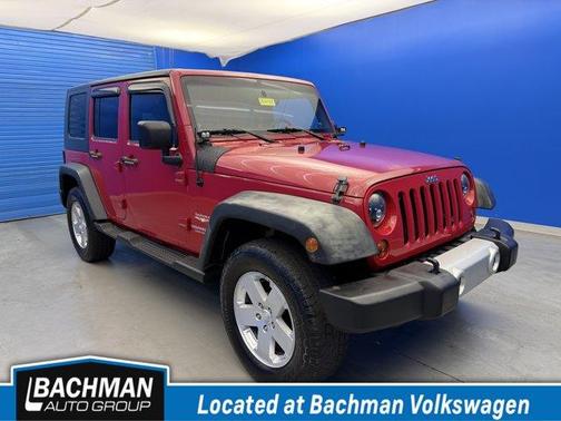 Flame Red 2010 Jeep Wrangler Unlimited Sahara