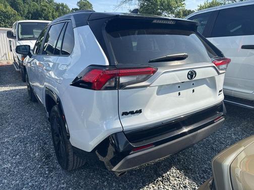 Wind Chill Pearl/Midnight Black Metallic 2025 Toyota RAV4 Hybrid SE
