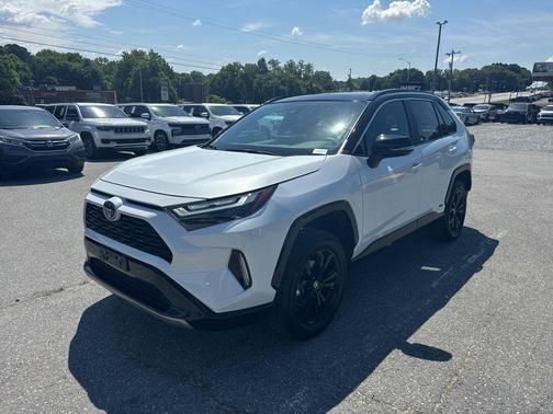 Wind Chill Pearl/Midnight Black Metallic 2025 Toyota RAV4 Hybrid SE