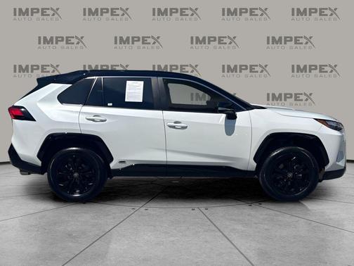 Wind Chill Pearl/Midnight Black Metallic 2025 Toyota RAV4 Hybrid SE