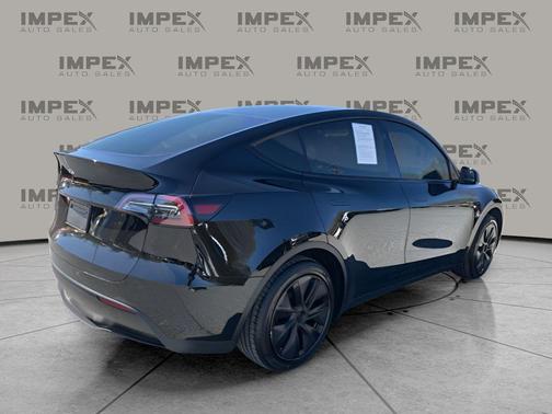 Solid Black 2025 Tesla Model Y Long Range Dual Motor Rear-Wheel Drive