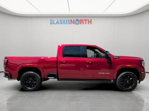 Volcanic Red Tintcoat 2025 GMC Sierra 2500 AT4