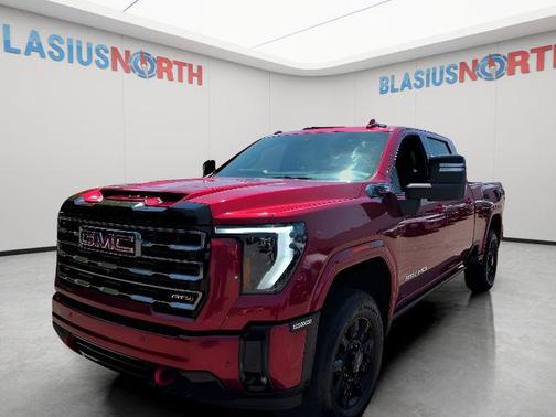 Volcanic Red Tintcoat 2025 GMC Sierra 2500 AT4