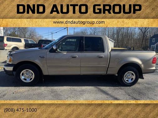 Tan 2002 Ford F-150 XLT SuperCrew Truck