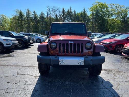 Red 2010 Jeep Wrangler Unlimited Sahara