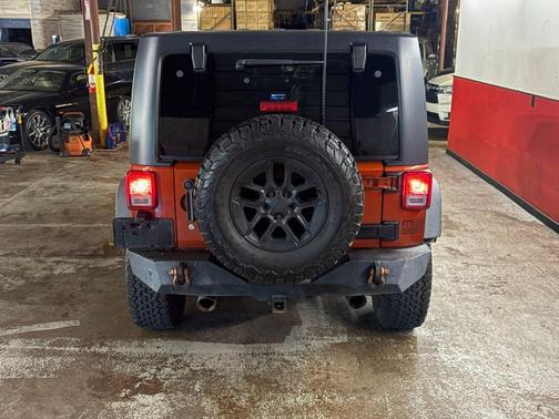 RED 2014 Jeep Wrangler Unlimited Sport