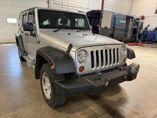 Bright Silver Metallic Clearcoat 2012 Jeep Wrangler Unlimited Sport RHD