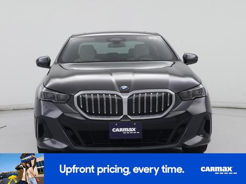 Black 2024 BMW 540 XI