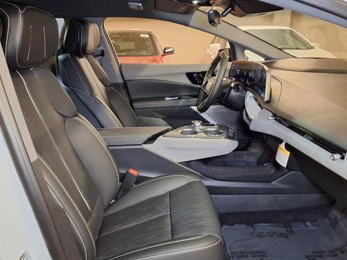 Vibrant White Tricoat 2026 Cadillac OPTIQ Premium Sport