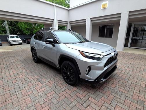 Silver Sky Metallic/Midnight Black Metallic 2023 Toyota RAV4 Hybrid SE