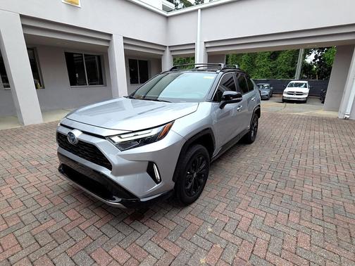 Silver Sky Metallic/Midnight Black Metallic 2023 Toyota RAV4 Hybrid SE