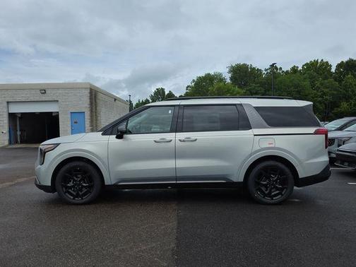 Ivory Silver 2026 Kia Carnival Hybrid SX